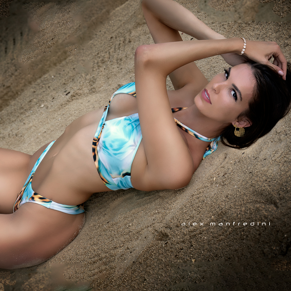Woman In Bikini On Sandy Beach